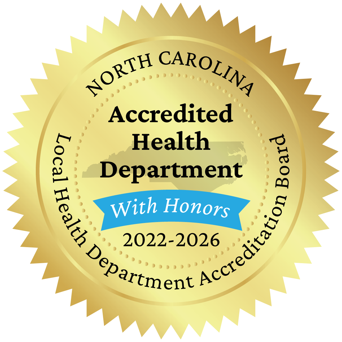 On November 18, 2022, Alexander County Health Department, along with ten other North Carolina health departments, was awarded reaccreditation with honors status by the North Carolina Local Health Department Accreditation (NCLHDA) Board. The six-year reaccreditation process and on-site survey came after a two-year delay as the result of the Covid-19 pandemic. During the six-year period covered by the survey Alexander County Health Department, along with many public health agencies across the state, worked diligently to care for the public during the coronavirus health crisis, continue the provision of essential health services to the community, and mitigate the challenges of staff turnover associated with the pandemic. “All of the agencies recently achieving reaccreditation have much to be proud of. They have not only demonstrated their ability to meet a set of important performance standards, but excelled in many areas. Through reaccreditation, these agencies demonstrate a strong commitment to continuously work to improve the quality of services provided to their respective communities,” comments Amy Belflower Thomas, NC Local Health Department Accreditation Administrator. Reaccreditation with Honors designation was awarded to Alexander County Health Department and ten other agencies. This honorary designation was implemented for the first time in fall of 2017 to recognize agencies that especially excelled in their accreditation assessment by missing one or less activities within each of standards set by the NCLHDA program. The program is especially pleased to see that this special recognition was achieved by such a diverse group of local health departments. Alexander County Health Department earned the designation by missing no activities in any of the standards for reaccreditation. “The team at Alexander County Health Department is pleased to have earned the designation of reaccreditation with honors,” said Billie Walker, health director for Alexander County. “The past few years have been extremely challenging for everyone, and especially for those working in public health. To earn the with honors designation in any year is quite an accomplishment; however, to earn it following the unprecedented health crisis of Covid demonstrates the unwavering commitment to the health of Alexander County that our team lives by each and every day.” North Carolina is the first state in the country to mandate accreditation for its local health departments. The purpose of the accreditation program is to assure a basic level of capacity and services in each of the local health departments across the state. The process of accreditation includes three major components – a self-assessment completed by the agency, a site visit by a multidisciplinary team of peers to review performance standards, and determination of accreditation status by an independent Accreditation Board comprised of state and local public health officials, Board of Health members, County Commissioners, and public members. The NC Local Health Department Accreditation program is a collaboration of the North Carolina Institute for Public Health (part of the Gillings School of Global Public Health at the University of North Carolina at Chapel Hill) and the North Carolina Association of Local Health Directors.